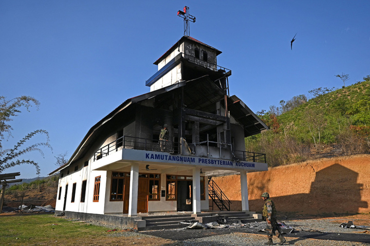 Indian army soldiers inspect the debris of a ransacked church that was set on fire by a mob in the ethnic violence hit area of Heiroklian village in Senapati district, in India's Manipur state on May 8, 2023. - Around 23,000 people have fled the unrest which erupted last week in the hilly northeast state bordering Myanmar. The latest clashes erupted between the majority Meitei people, who are mostly Hindu, living in and around the Manipur capital Imphal and the mainly Christian Kuki tribe of the hills. (Photo by Arun SANKAR / AFP) (Photo by ARUN SANKAR/AFP via Getty Images)