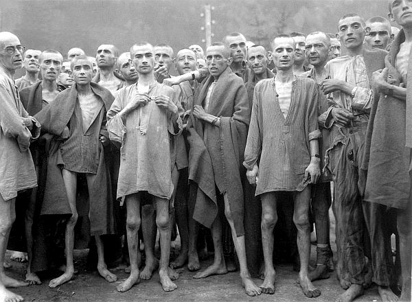 Starved prisoners, nearly dead from hunger, pose in concentration camp in Ebensee, Austria.  The camp was reputedly used for "scientific" experiments.  It was liberated by the 80th Division.  May 7, 1945.  Lt. A. E. Samuelson.  (Army)
NARA FILE #:  111-SC-204480
WAR & CONFLICT BOOK #:  1103